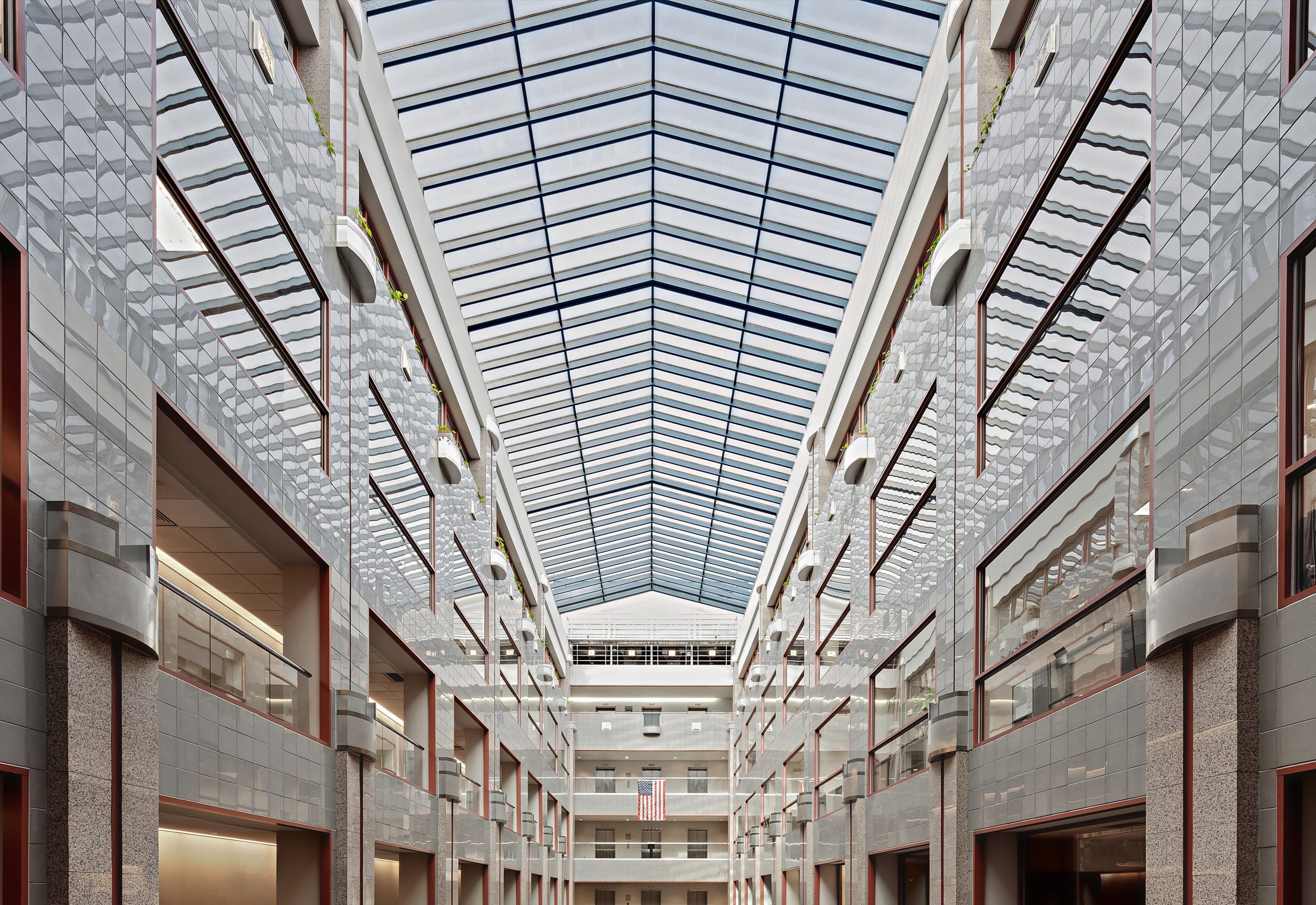A skylit office galleria atrium with tiered balconies